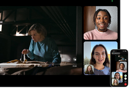 Mac and iPhone: SharePlay split view on Mac, Apple TV show plays on left, FaceTime tiles on right show three people, iPhone mounted beside Mac used as Continuity Camera