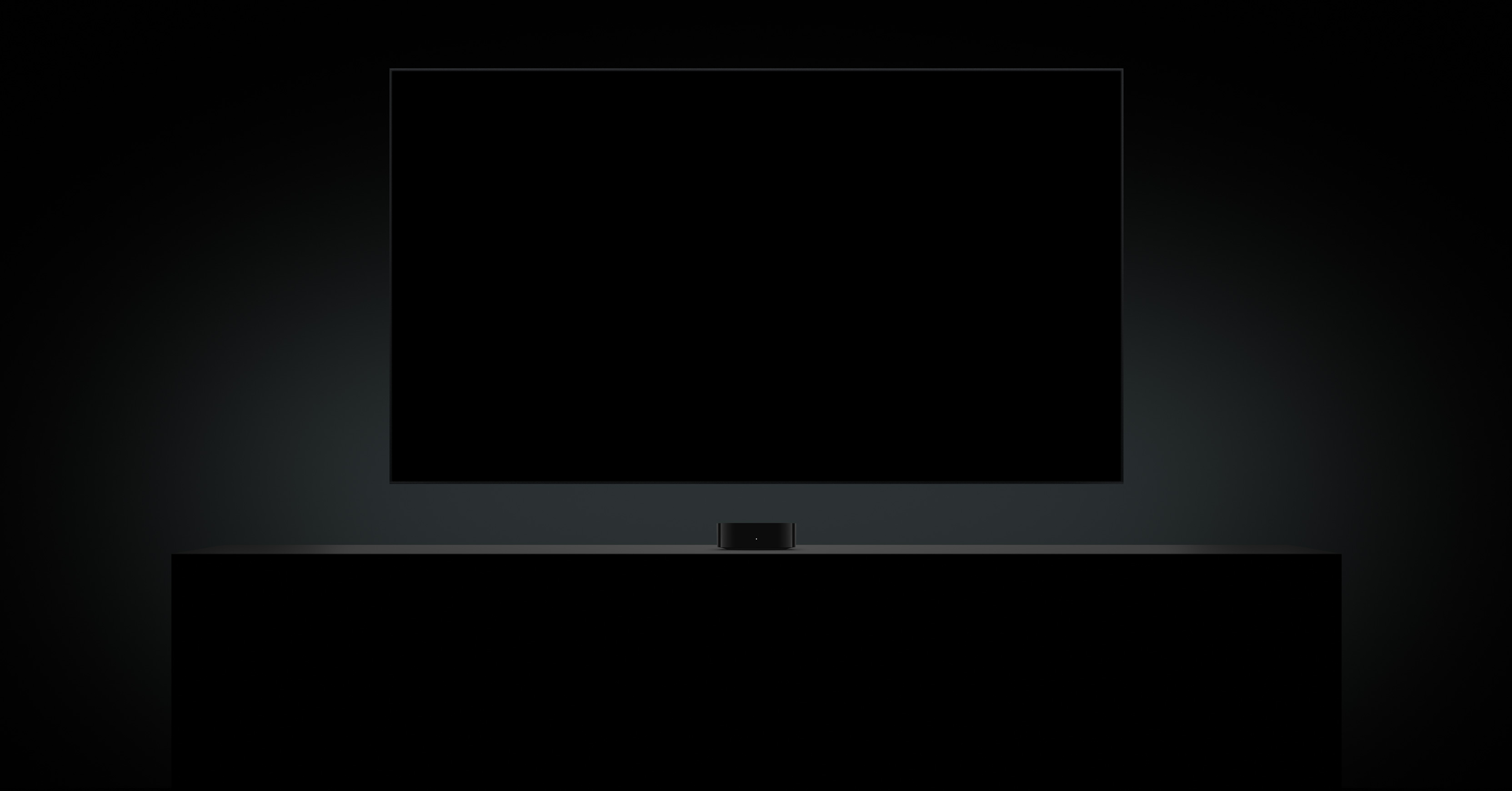 Apple TV 4K below TV screen, screen shows close-up of glowing eye, dark room setting