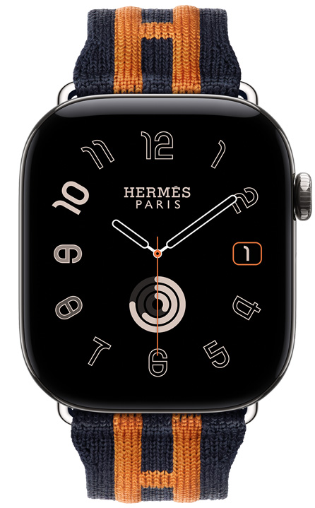 Apple Watch Hermès Series 12, carátula analógica Radial, (agujas de hora, minuto y segundo, complicaciones: fecha, círculos de Actividad), caja de titanio, color plata, parte lateral derecha, Digital Crown, botón lateral en relieve, con la correa Rocabar Club, color Bleu Nuit/Orange, tejido azul oscuro con un diseño en relieve de rayas naranjas que incorpora la H de Hermès