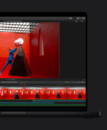 MacBook Pro 16, Video timeline of edit, man in blue suit in red room balancing giant round pearl atop a black pyramid