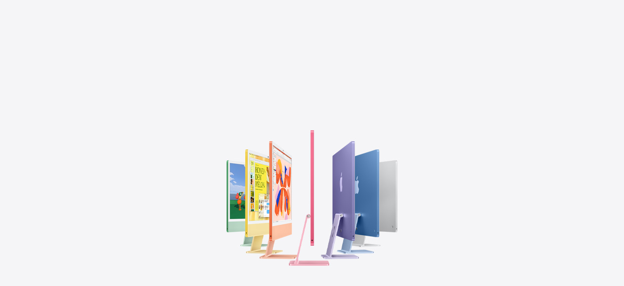 Seven iMac models in colours green, yellow, orange, pink, purple, blue and silver, in an accordion arrangement