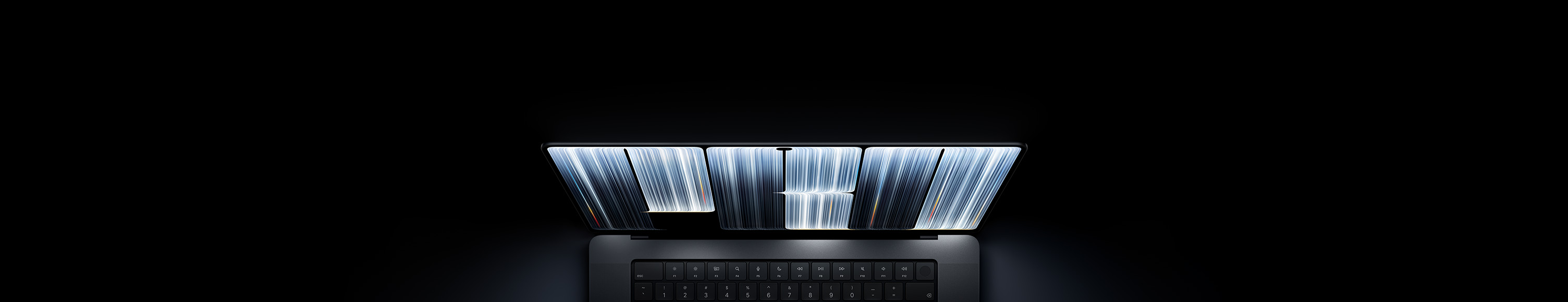 MacBook Pro with PROLED XDR Display, space black colour, screen shows ribbonlike objects densely patterned with glowing stripes of various widths, spelling the word Pro.