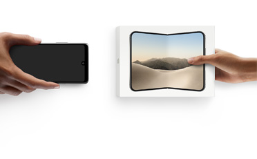 Hands exchanging trade-in Android smartphone for new iPhone Duo in the box