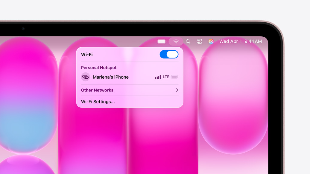 MacBook Neo, blush colour, Wi-Fi menu shows Personal Hotspot section with ”Marlena's iPhone” as an option to select