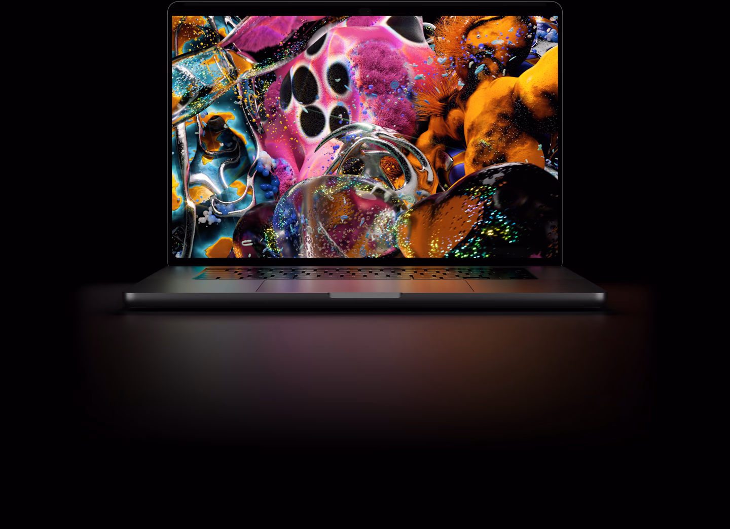 MacBook Pro med PROLED XDR-skærm i farven space black, skærmen viser et detaljeret billede med høj kontrast og levende farver, tastaturet oplyses af skærmen